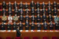 FILE - In this May 28, 2020, file photo, delegates applaud as Chinese President Xi Jinping arrives for the closing session of China's National People's Congress (NPC) in Beijing. The annual gathering of the National People's Congress and its advisory body, the Chinese People's Political Consultative Conference, brings handpicked delegates from across the country to discuss governing priorities and receive instructions from the ruling Communist Party leadership. (AP Photo/Mark Schiefelbein, File)