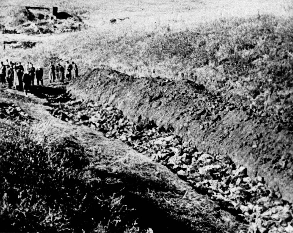 <span class="caption">A 1944 file photo of part of the Babi Yar ravine on the outskirts of Kiev, Ukraine, where the advancing Red Army unearthed the bodies of 14,000 civilians killed by fleeing Nazis.</span> <span class="attribution"><a class="link " href="https://newsroom.ap.org/detail/UkraineBabiYar/dfc66c28aa8f498e9002b1ceaf284e4f/photo?Query=babi%20yar&mediaType=photo&sortBy=&dateRange=Anytime&totalCount=121&currentItemNo=45" rel="nofollow noopener" target="_blank" data-ylk="slk:AP Photo, file;elm:context_link;itc:0;sec:content-canvas">AP Photo, file</a></span>