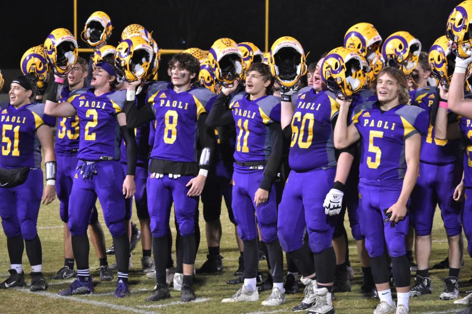 The Paoli football team sings the school fight song to its fans after throttling Union County in the opening round of sectional play last year.