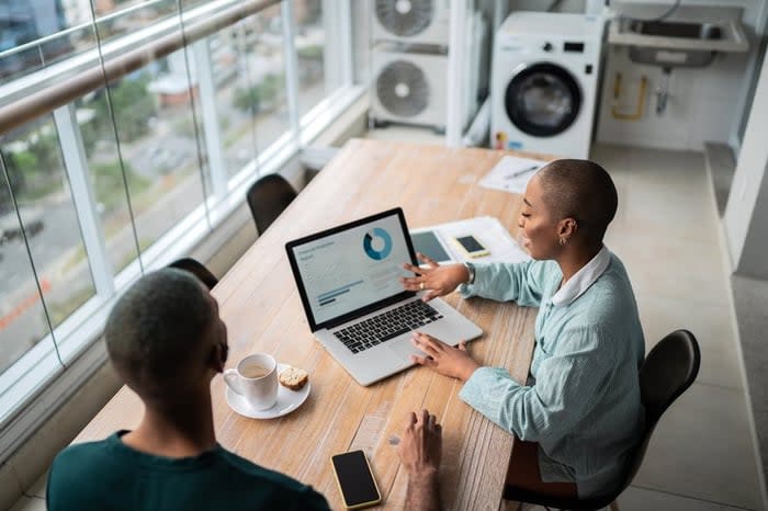 Financial advisor discusses credit scores with a client.