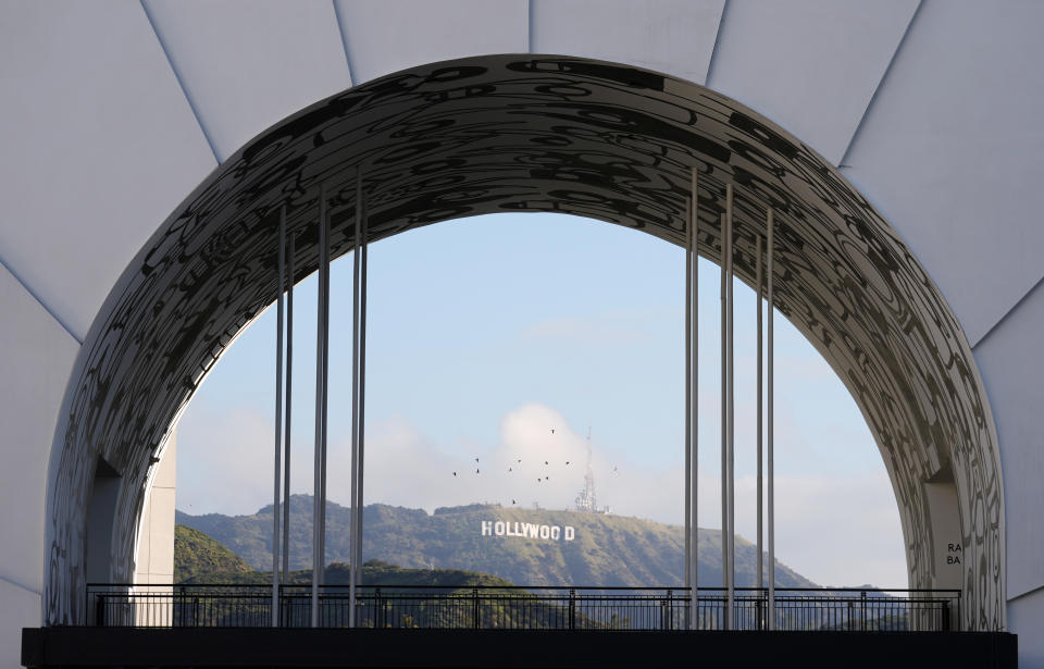 The Hollywood sign is pictured through an archway near the Dolby Theatre, Wednesday, March 6, 2024, the site of Sunday's 96th Academy Awards in Los Angeles. (AP Photo/Chris Pizzello)