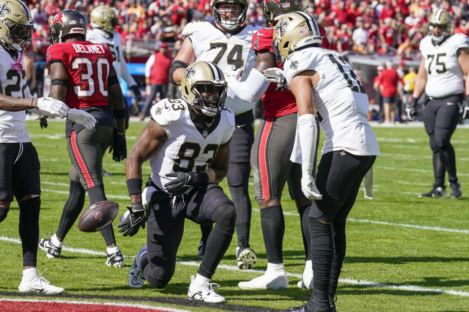 New Orleans Saints tight end Juwan Johnson (83) gets up after scoring on a touchdown reception in the first half of an NFL football game against the Tampa Bay Buccaneers in Tampa, Fla., Sunday, Dec. 31, 2023. (AP Photo/Chris O'Meara)