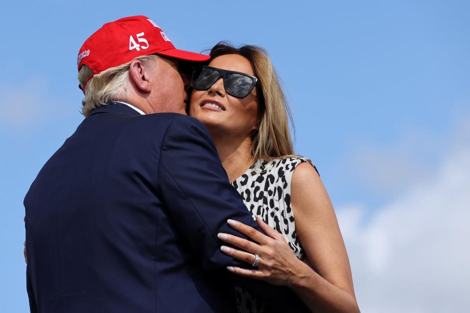 <p>President Donald Trump kisses first lady Melania Trump ahead of a campaign rally outside Raymond James Stadium, in Tampa, Florida. REUTERS/Jonathan Ernst</p> (REUTERS)