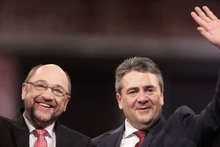 Outgoing Social Democratic Party (SPD) leader Sigmar Gabriel and incoming party leader and candidate in the upcoming general elections Martin Schulz during SPD party convention in Berlin, Germany, March 19, 2017. REUTERS/Axel Schmidt