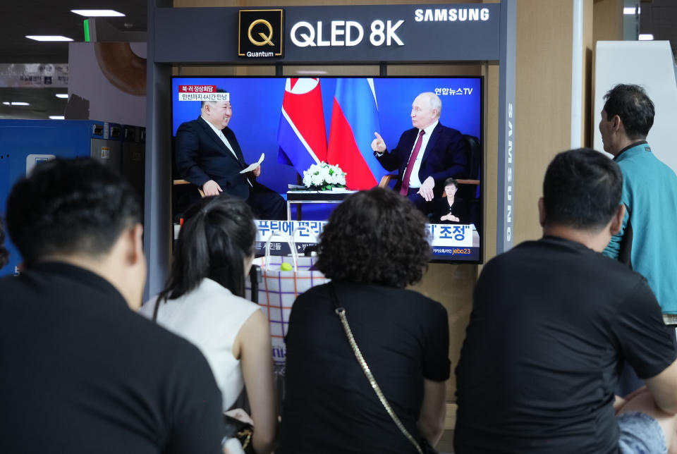 A TV screen shows an image of a meeting between Russian President Vladimir Putin, right, and North Korea's leader Kim Jong Un during a news program at the Seoul Railway Station in Seoul, South Korea, Thursday, Sept. 14, 2023. Kim vowed "full and unconditional support" for Putin on Wednesday as the two leaders isolated by the West held a summit that the U.S. warned could lead to a deal to supply ammunition for Moscow's war in Ukraine. (AP Photo/Ahn Young-joon)