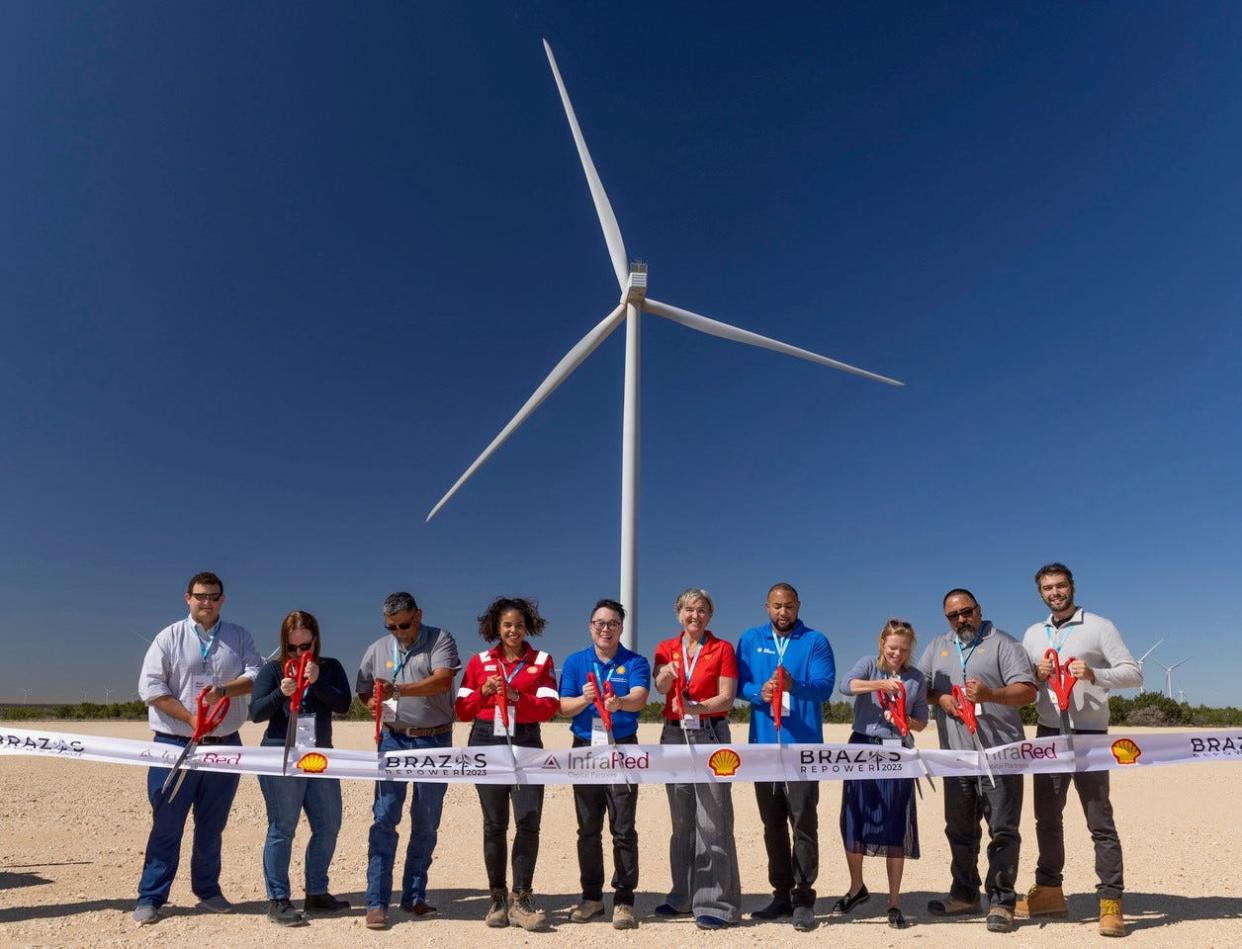 People attend a ribbon cutting for the reopening of the Brazos Wind Farm in Fluvanna. Matt Solnick, InfraRed Capital Partners; Annika Venning, InfraRed Capital Partners; Ed Rivera, Global Operations Manager, Asset Management, Shell Energy; Carina Lopez, HSSE Manager Onshore Renewable Power, Shell Energy; Brian Kwan, Project Delivery Manager, Shell Energy; Dana Herrera, General Manager, Renewable Asset Management, Shell Energy; Jarrette Lewis, Sr. Renewable Power Project Developer, Shell Energy; Jolanda Koot, Commercial Manager Onshore Renewable Power, Shell Energy; Tony Rodriguez, Field Operations, Lead Asset Management, Shell Energy; and Gokhan Tekiner, Deal Lead RES Americas, Shell Energy; hold the ribbon.