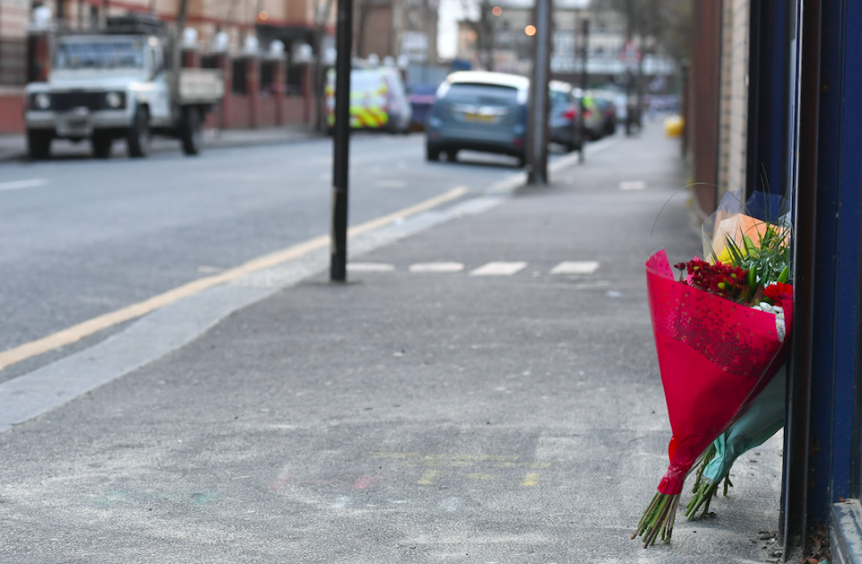 <em>Flowers have been left at the scene of the stabbing (PA)</em>