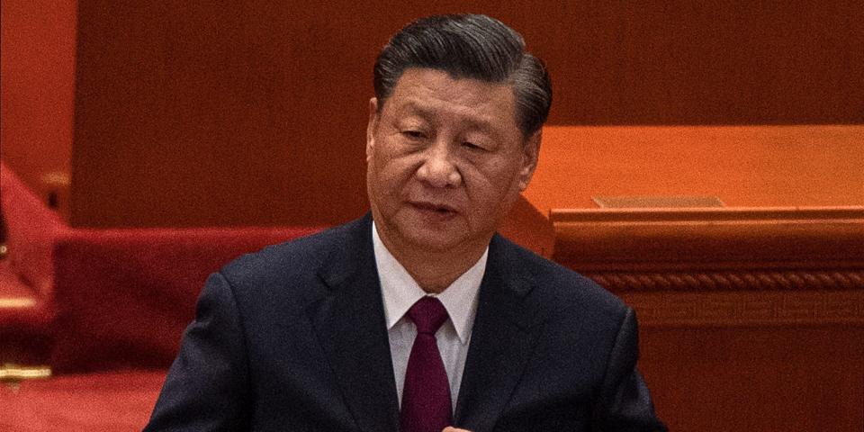 Chinese President Xi Jinping buttons his jacket