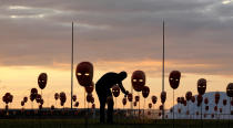 <p>A man paints masks during a protest by non-governmental organization (NGO) Rio de Paz (Rio of Peace) against political corruption scandals, in front of the National Congress in Brasilia, Brazil May 23, 2017. (Photo: Paulo Whitaker/Reuters) </p>