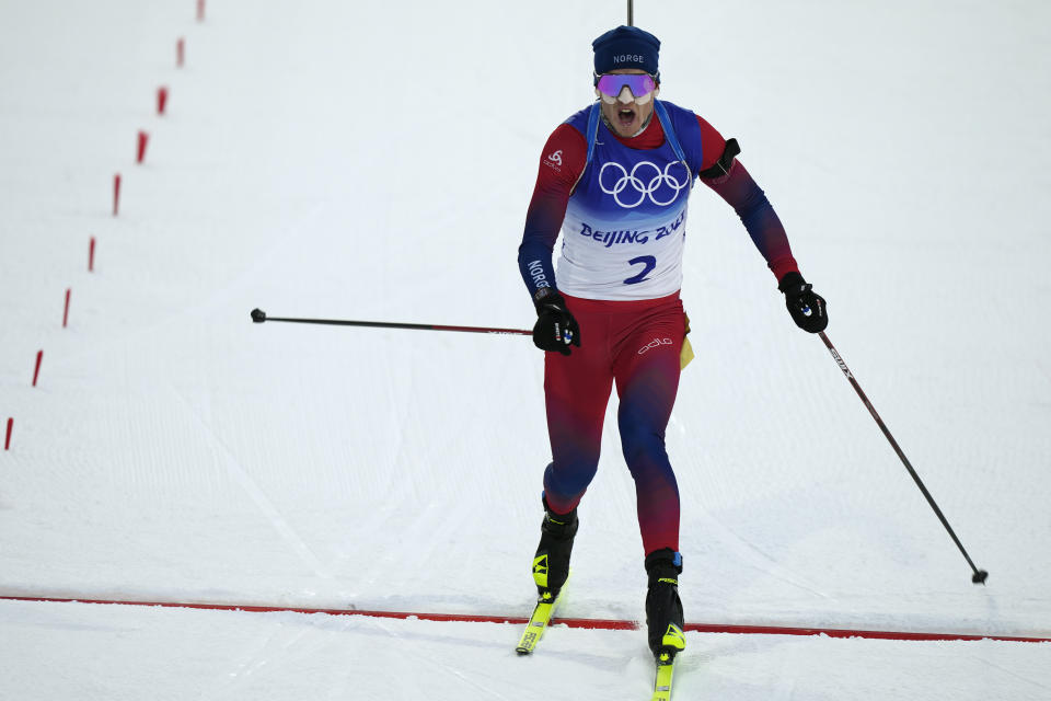 Johannes Thingnes Boe of Norway crosses the finish line during the men's 20-kilometer individual race at the 2022 Winter Olympics, Tuesday, Feb. 8, 2022, in Zhangjiakou, China. (AP Photo/Frank Augstein)