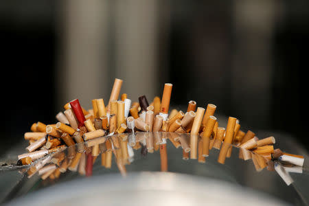 Extinguished cigarettes are seen in an ashtray at Shanghai Railway Station, China, December 23, 2013. REUTERS/Aly Song/File Photo