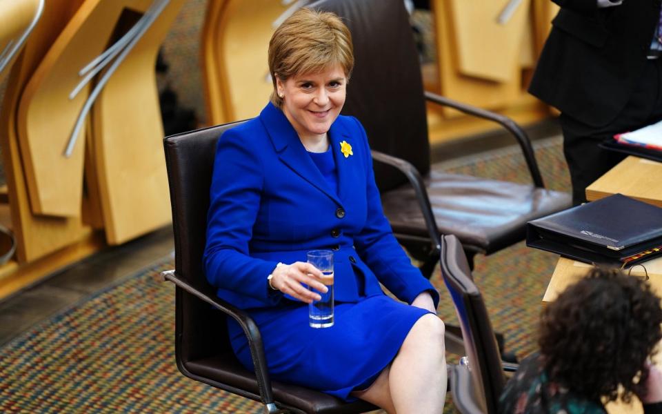 Nicola Sturgeon is pictured at lunchtime during her last First Minister's Questions - Jane Barlow /PA