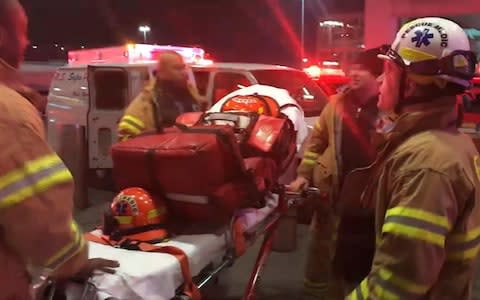 Emergency medical personnel work at New York's John F. Kennedy International Airport, Saturday, March 9, 2019 - Credit: WNBC