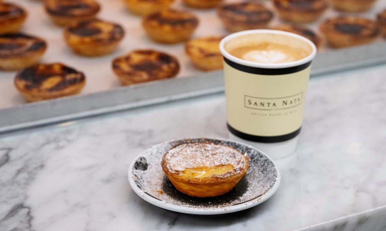 <span>A Portuguese custard tart (<em>pastel de nata) </em>with a coffee at Santa Nata in Covent Garden, London. </span><span>Photograph: Linda Nylind/The Guardian</span>