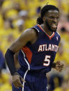 Atlanta Hawks' DeMarre Carroll reacts after hitting a basket during the second half in Game 1 of an opening-round NBA basketball playoff series against the Indiana Pacers, Saturday, April 19, 2014, in Indianapolis. Atlanta defeated Indiana 101-93. (AP Photo/Darron Cummings)