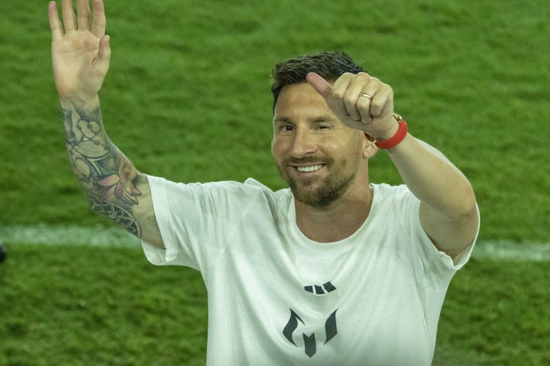 Seven-time Ballon d'Or winner Lionel Messi waves to fans at his Inter Miami CF introduction on Sunday at DRV Pink Stadium in Fort Lauderdale, Fla. Photo by Gary I Rothstein/UPI