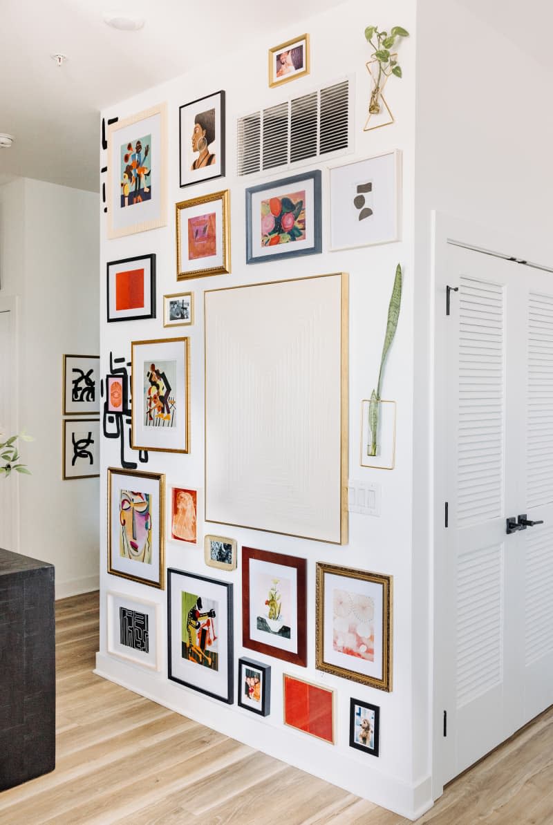 White hallway area with gallery wall