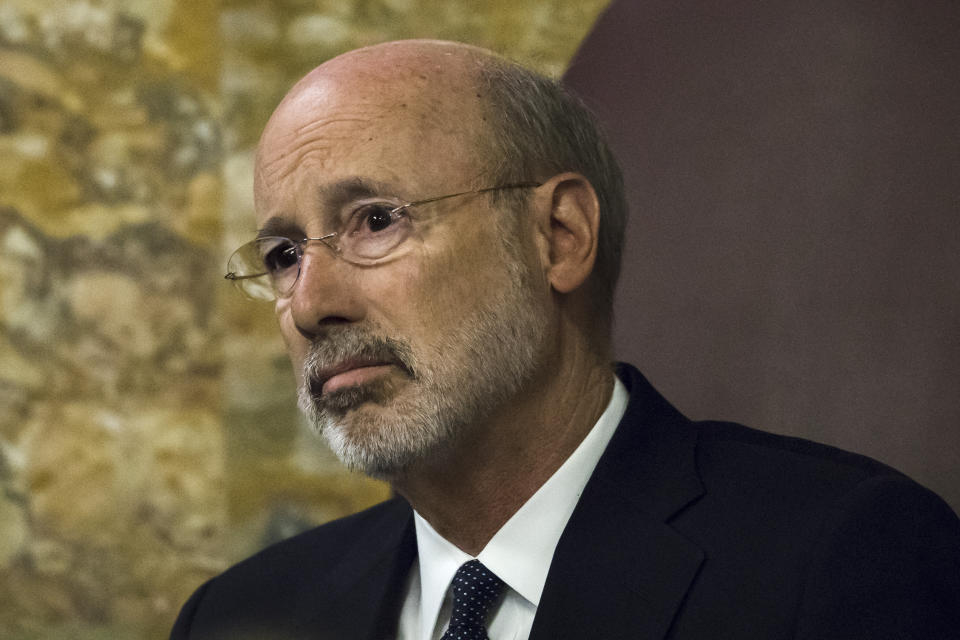 Gov. Tom Wolf listens as Pennsylvania lawmakers come together in an unusual joint session to commemorate the victims of the Pittsburgh synagogue attack that killed 11 people last year, Wednesday, April 10, 2019, at the state Capitol in Harrisburg, Pa. (AP Photo/Matt Rourke)