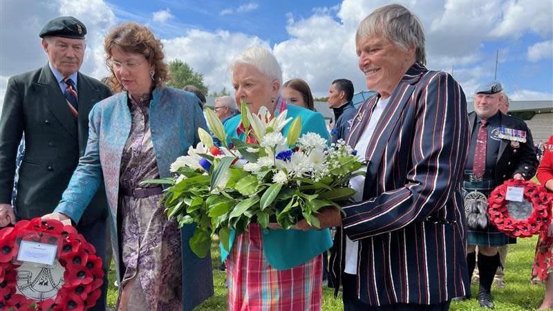 Families of Maj John Howard and Lt Den Brotheridge laying wreaths and flowers at the memorial site at Pegasus Bridge