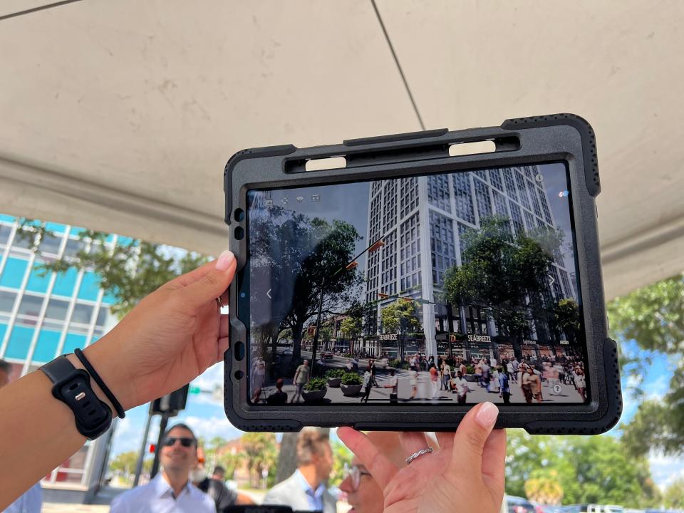 Gateway Jax LLC hosted a walking tour to showcase their plans for a multi-use development called the "Pearl Street District" in Downtown Jacksonville on Wednesday, Sept. 20, 2023. They used iPads to show how various parts of the district would look.