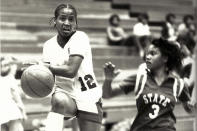 This undated photo provided by Francis Marion University shows women's basketball player Pearl Moore, left, during a basketball game against South Carolina State. Long before Iowa star Caitlin Clark hit her first long-range three or signed her first autograph, Hall of Famer Pearl Moore had already set the scoring standard for women's basketball. Moore began her journey as the game's greatest female scorer in an era when women were not encouraged to play sports. (Francis Marion University via AP)