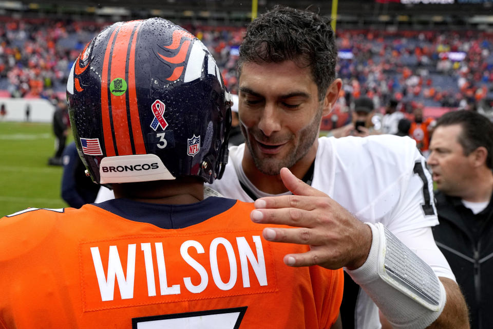 Denver Broncos quarterback Russell Wilson (3) greets Las Vegas Raiders quarterback Jimmy Garoppolo (10) after an NFL football game, Sunday, Sept. 10, 2023, in Denver. The Raiders defeated the Broncos 17-16. (AP Photo/Jack Dempsey)