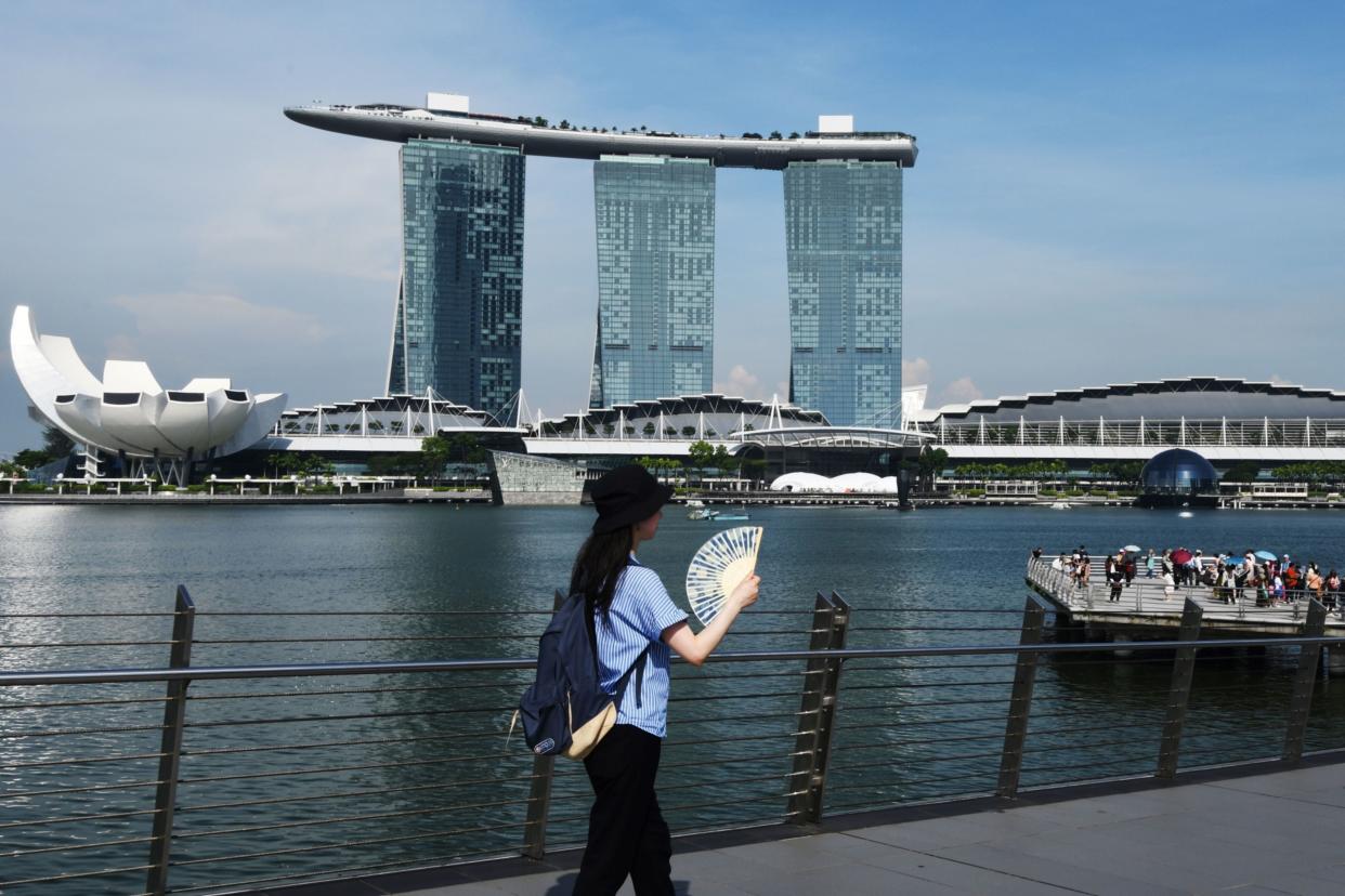 A woman visits the Marina Bay area in Singapore on May 18, 2023. (Photo: Then Chih Wey/Xinhua/Getty Images via Bloomberg)