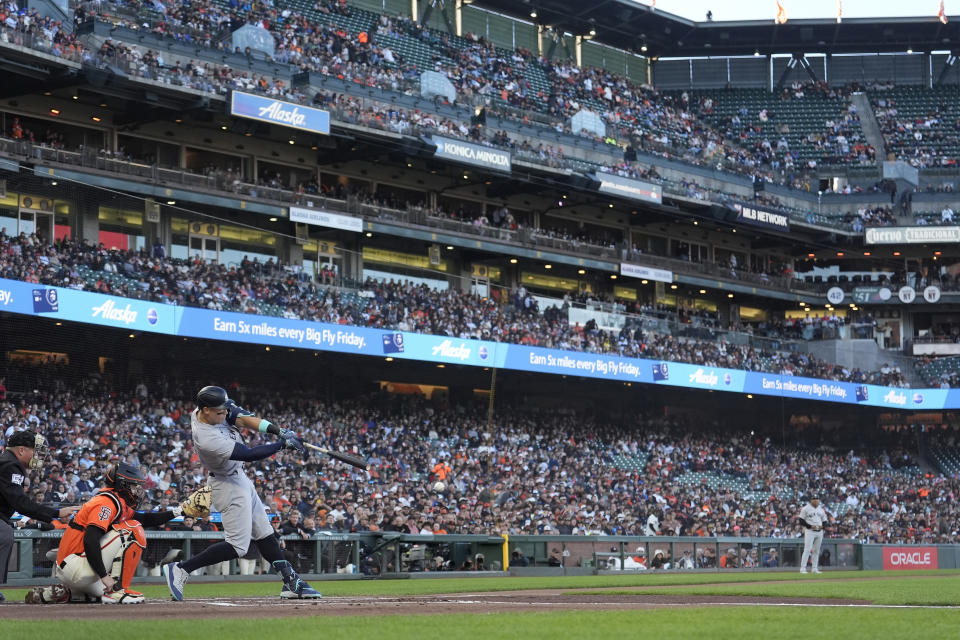 New York Yankees' Aaron Judge hits a single in front of San Francisco Giants catcher Patrick Bailey during the first inning of a baseball game in San Francisco, Friday, May 31, 2024. (AP Photo/Jeff Chiu)