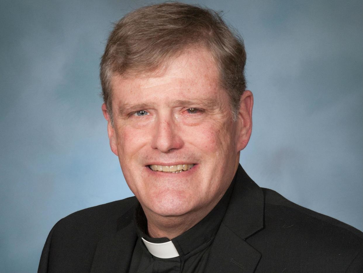 Father William Aitcheson stepped down from his role in the church after revealing his past as a member of the KKK: Courtesy of the Arlington Catholic Herald