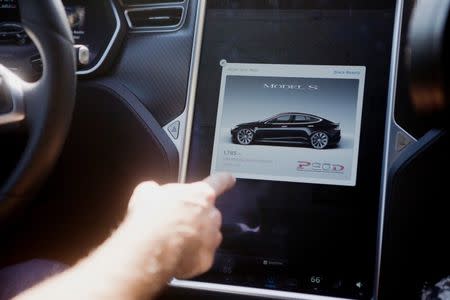 The Tesla Model S version 7.0 software update containing Autopilot features is demonstrated during a Tesla event in Palo Alto, California, U.S., October 14, 2015. REUTERS/Beck Diefenbach/File Photo