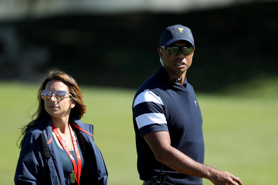 Tiger Woods, one of the United States' team assistant captains, is seen with Erica Herman during the 2017 Presidents Cup at the Liberty National Golf Club in October 2017, in Jersey City, New Jersey. / Credit: David Cannon / Getty Images