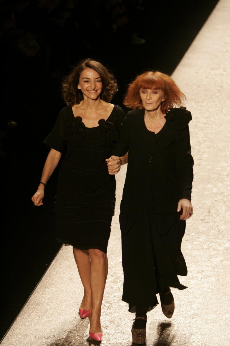 Sonia Rykiel walks the runway with her daughter, Nathalie, following her spring-summer 2007 runway show in Paris.