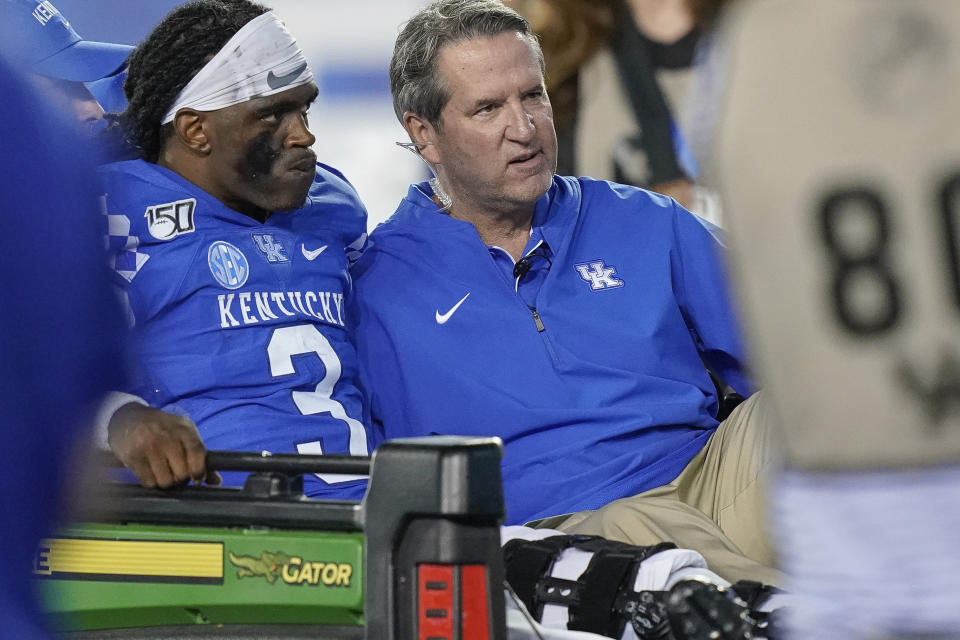 Kentucky quarterback Terry Wilson (3) is is carted off the field after being injured during the second half of an NCAA college football game between Kentucky and Eastern Michigan, Saturday, Sept. 7, 2019, in Lexington, Ky. Wilson was injured and left the game on a cart as a result of the play. (AP Photo/Bryan Woolston)