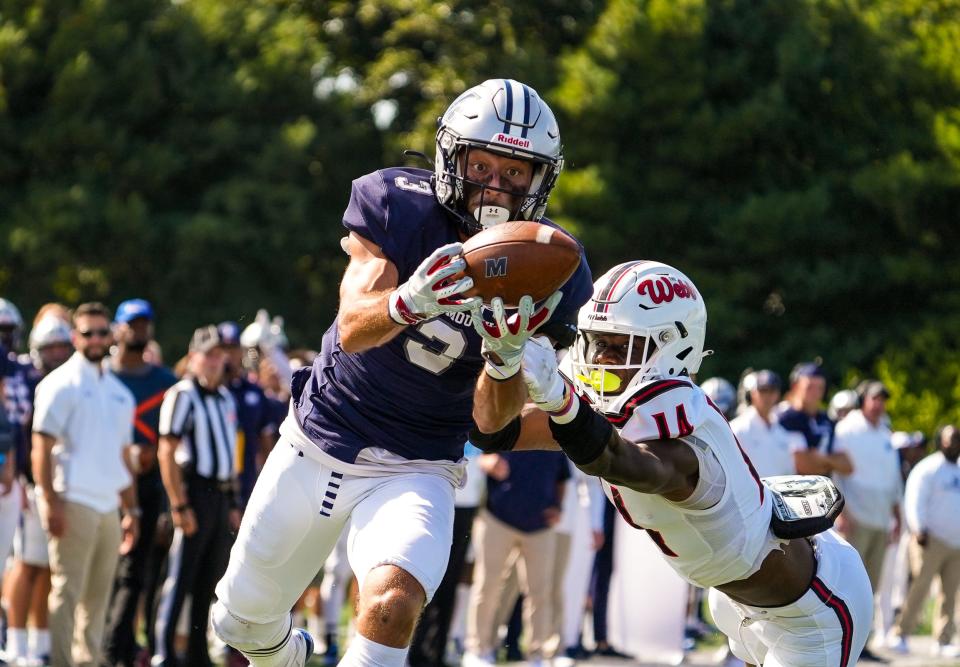 Monmouth's Joey Aldarelli catches a touchdown pass from Tony Muskett against Gardner-Webb on Oct. 2, 2021 in West Long Branch.