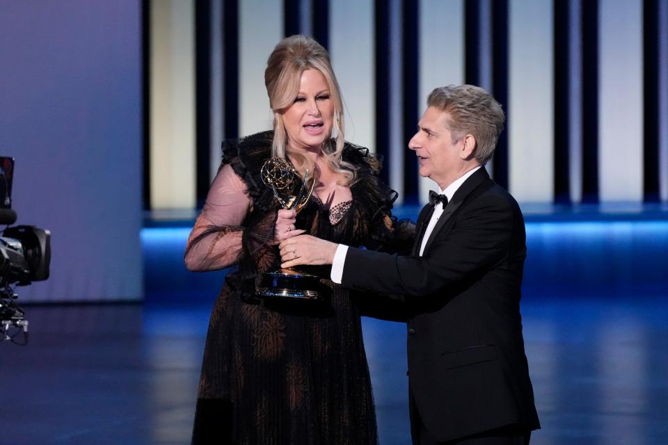 Jennifer Coolidge accepts the award for outstanding supporting actress in a drama series from Michael Imperioli during the 75th Emmy Awards at the Peacock Theater in Los Angeles on Monday, Jan. 15, 2024.