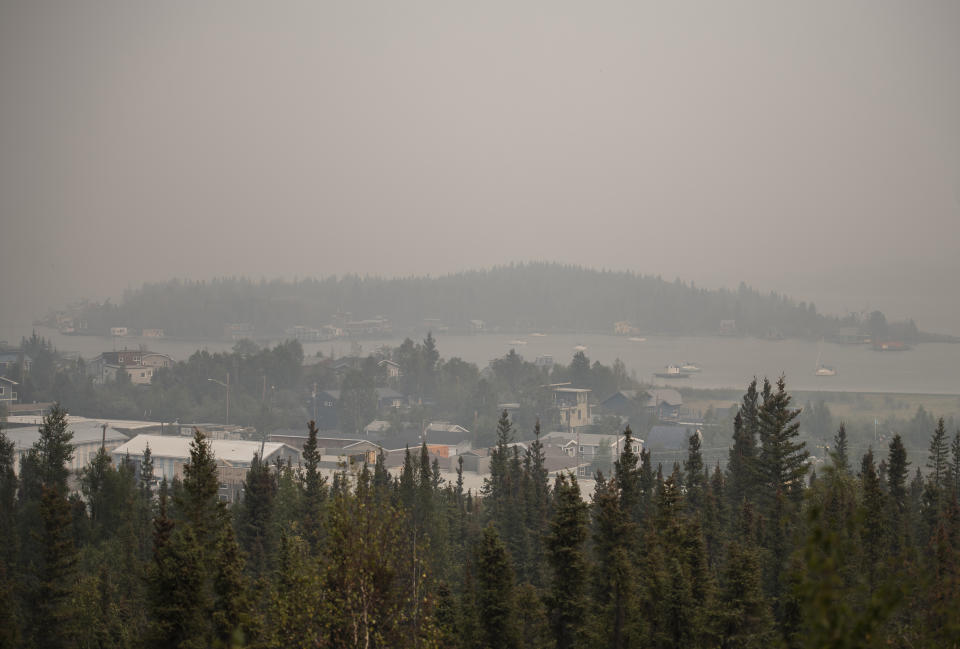 Heavy smoke from nearby wildfires fills the sky in Yellowknife on Tuesday, August 15, 2023. THE CANADIAN PRESS/Angela Gzowski