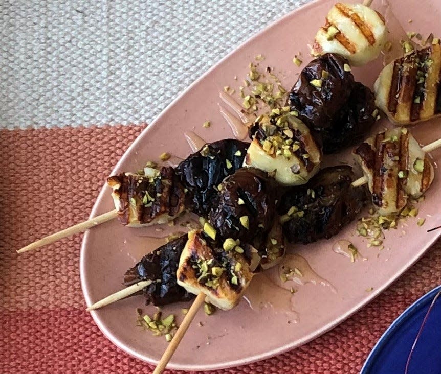 Grilled dates and haloumi cheese drizzled in honey and topped with pistachios.