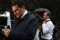 <p>A television presenter changes his tie outside Balmoral Castle, amid concerns over Britain's Queen Elizabeth's health, in Balmoral, Scotland, Britain September 8, 2022. REUTERS/Russell Cheyne - RC25DW9QLKYT</p> 