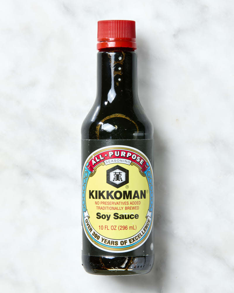 overhead shot of soy sauce on a marble surface.