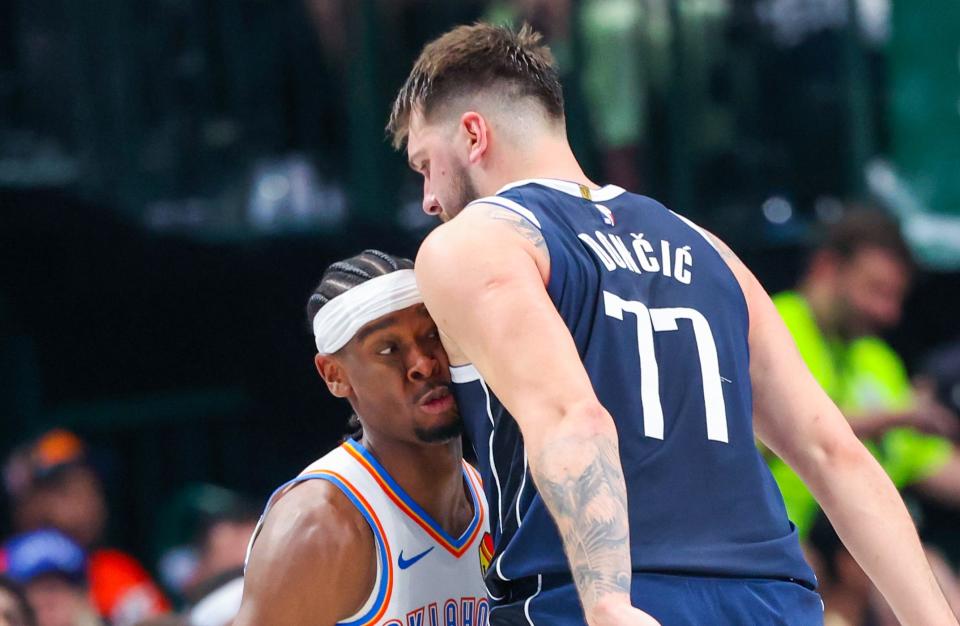 May 11, 2024; Dallas, Texas, USA; Oklahoma City Thunder guard Shai Gilgeous-Alexander (2) runs into Dallas Mavericks guard Luka Doncic (77) during the first half during game three of the second round for the 2024 NBA playoffs at American Airlines Center.
