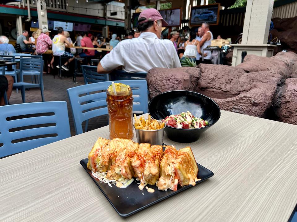 Down the Hatch meal: mai tai, loaded grilled cheese, fries, and poke bowl