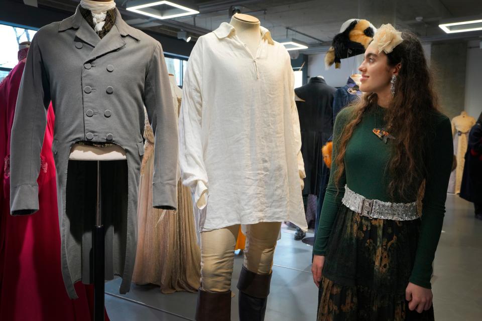 Star Arkana, a young ambassador from The Bright Foundation, looks at Colin Firth's 'wet-shirt' costume as Mr. Darcy in the TV series "Pride and Prejudice" (1995), at Kerry Taylor Auctions in London, Tuesday, Feb. 27, 2024.