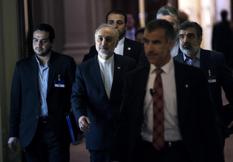 The head of Iranian Atomic Energy Organization, Ali Akbar Salehi (C), walks after a meeting at the Beau Rivage Palace Hotel during an extended round of nuclear talks on April 1, 2015 in Lausanne