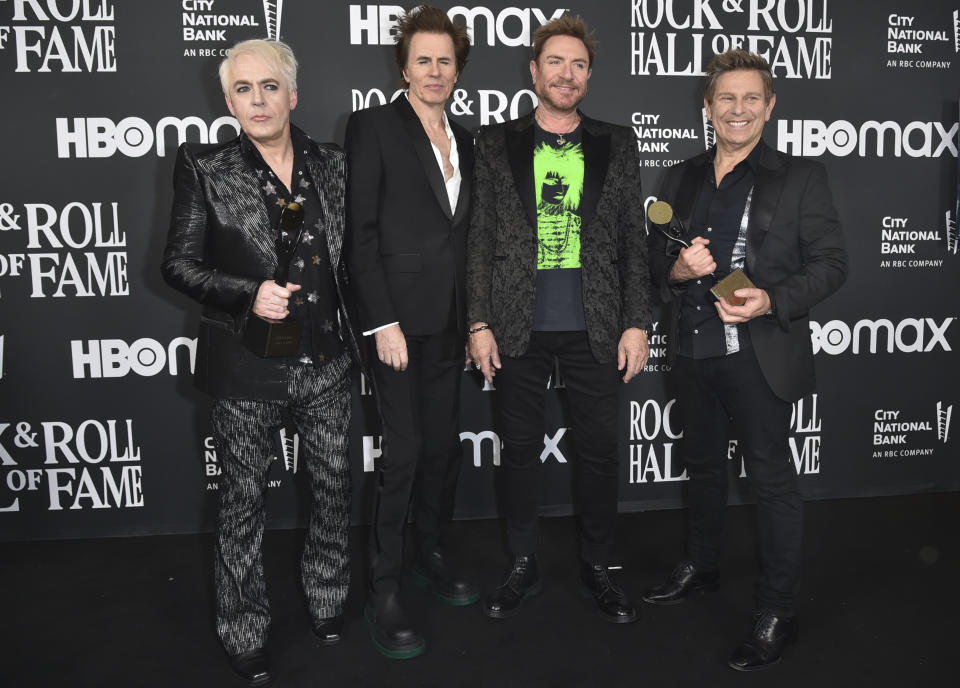 FILE - Inductees Nick Rhodes, from left, John Taylor, Simon Le Bon, and Roger Taylor of Duran Duran appear in the press room during the Rock & Roll Hall of Fame Induction Ceremony in Los Angeles on Nov. 5, 2022. The band will perform on ABC's “New Year’s Rockin’ Eve.” (Photo by Richard Shotwell/Invision/AP)