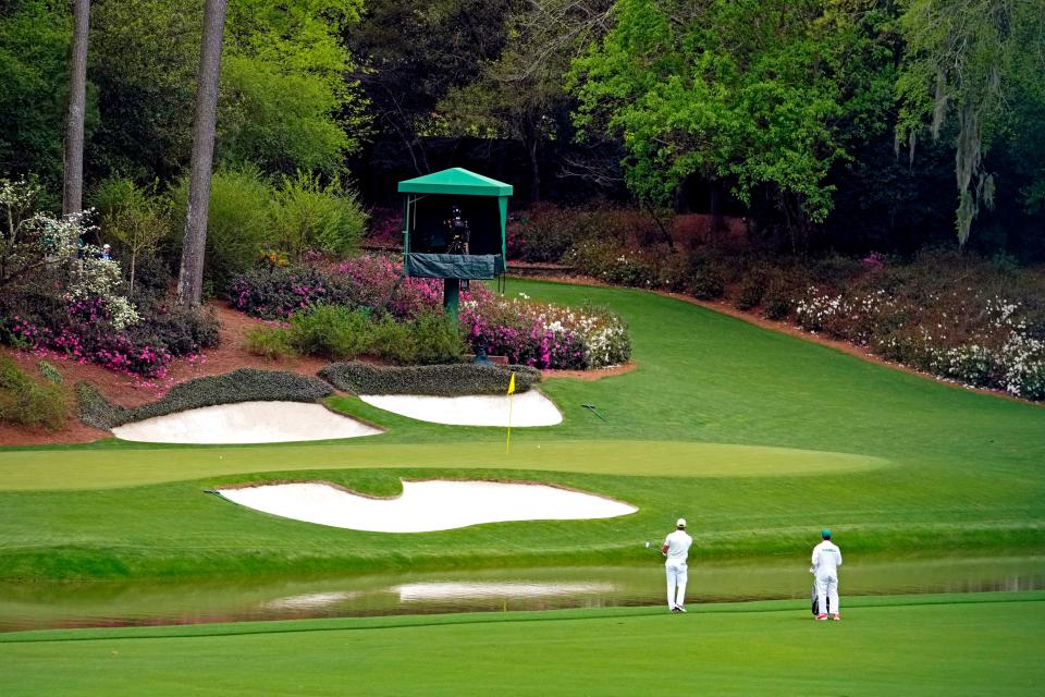 Bryson DeChambeau chips on the 13th hole during the second round of the 2022 Masters golf tournament at Augusta National.