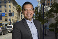 Long Beach, Calif., Mayor-elect Robert Garcia poses on Pine Avenue after his election in Long Beach on July 11, 2014. The potential ascendancy of Sen. Kamala Harris to the vice presidency next year has kicked off widespread speculation about who might replace her if Democrats seize the White House. California Gov. Gavin Newsom is already being lobbied by hopefuls and numerous names are emerging in the early speculation. Garcia is the city's first openly gay mayor. (Jeff Gritchen/The Orange County Register via AP)