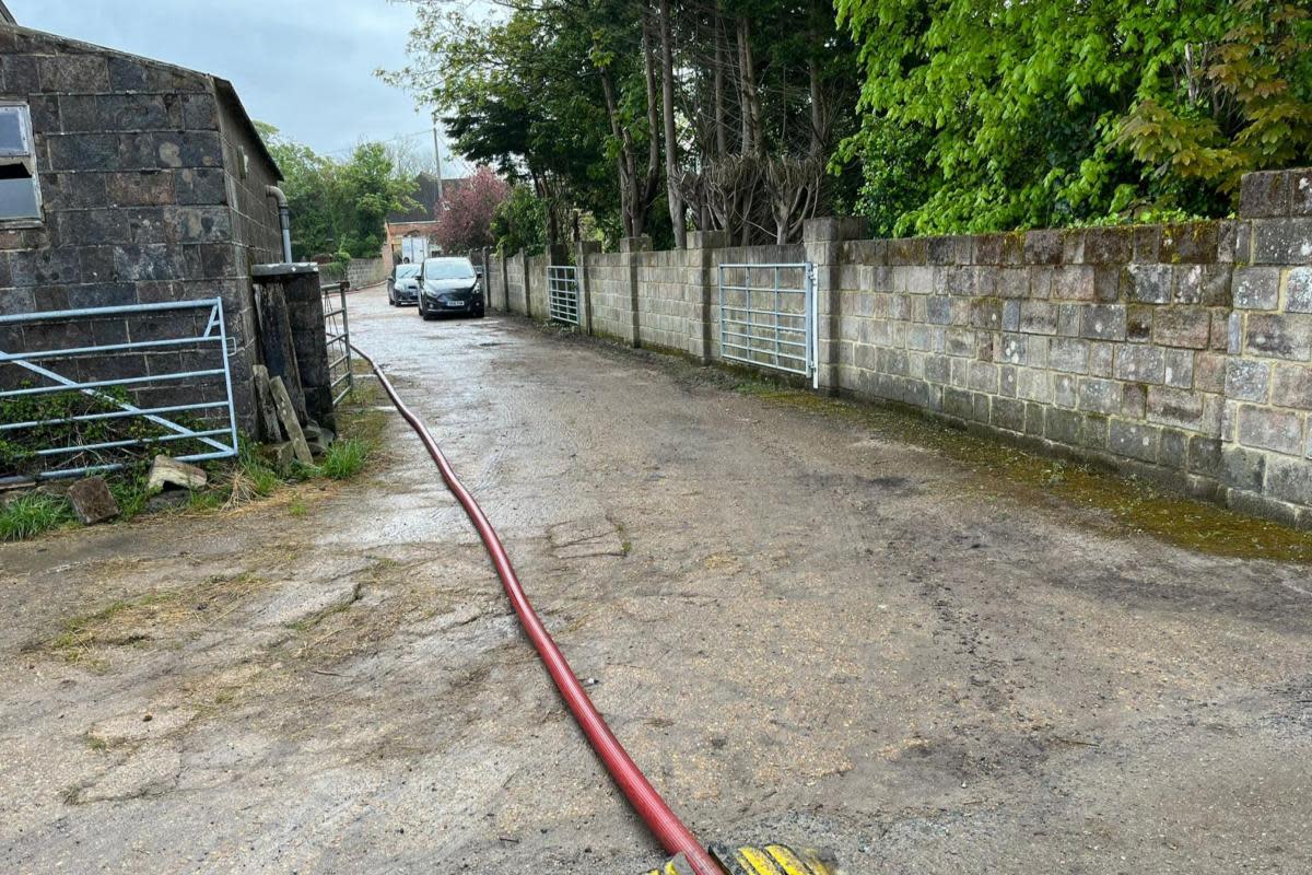A hose leading to firefighters tackling the blaze. <i>(Image: IWCP)</i>
