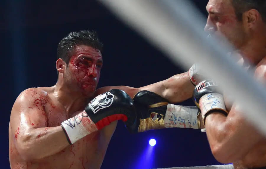 MOSCOW, RUSSIA - SEPTEMBER 08: Manuel Charr of Germany (l) punshes Vitali Klitschko of Ukraine (r) during the WBC-heavy weight title fight between Vitali Klitschko of Ukraine and Manuel Charr of Germany at Olimpiyskiy Arena on September 8, 2012 in Moscow, Russia. (Photo by Lars Baron/Bongarts/Getty Images)