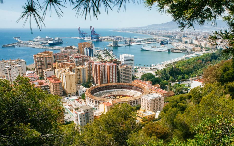 Landscape of Malaga with the bullring and the harbour