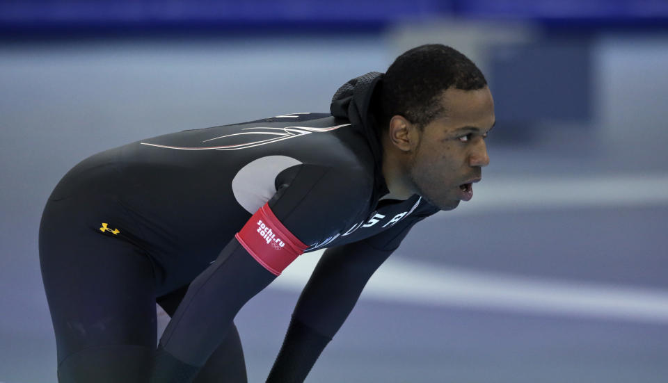 Shani Davis of the U.S. takes a breather after competing in the men's 1,000-meter speedskating race at the Adler Arena Skating Center during the 2014 Winter Olympics in Sochi, Russia, Wednesday, Feb. 12, 2014. (AP Photo/Matt Dunham)